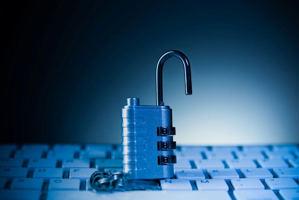 Key locking padlock representing WordPress website security hardening