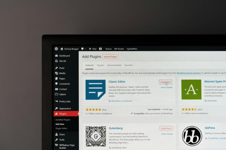 Developer writing custom PHP code for WordPress on a laptop screen
